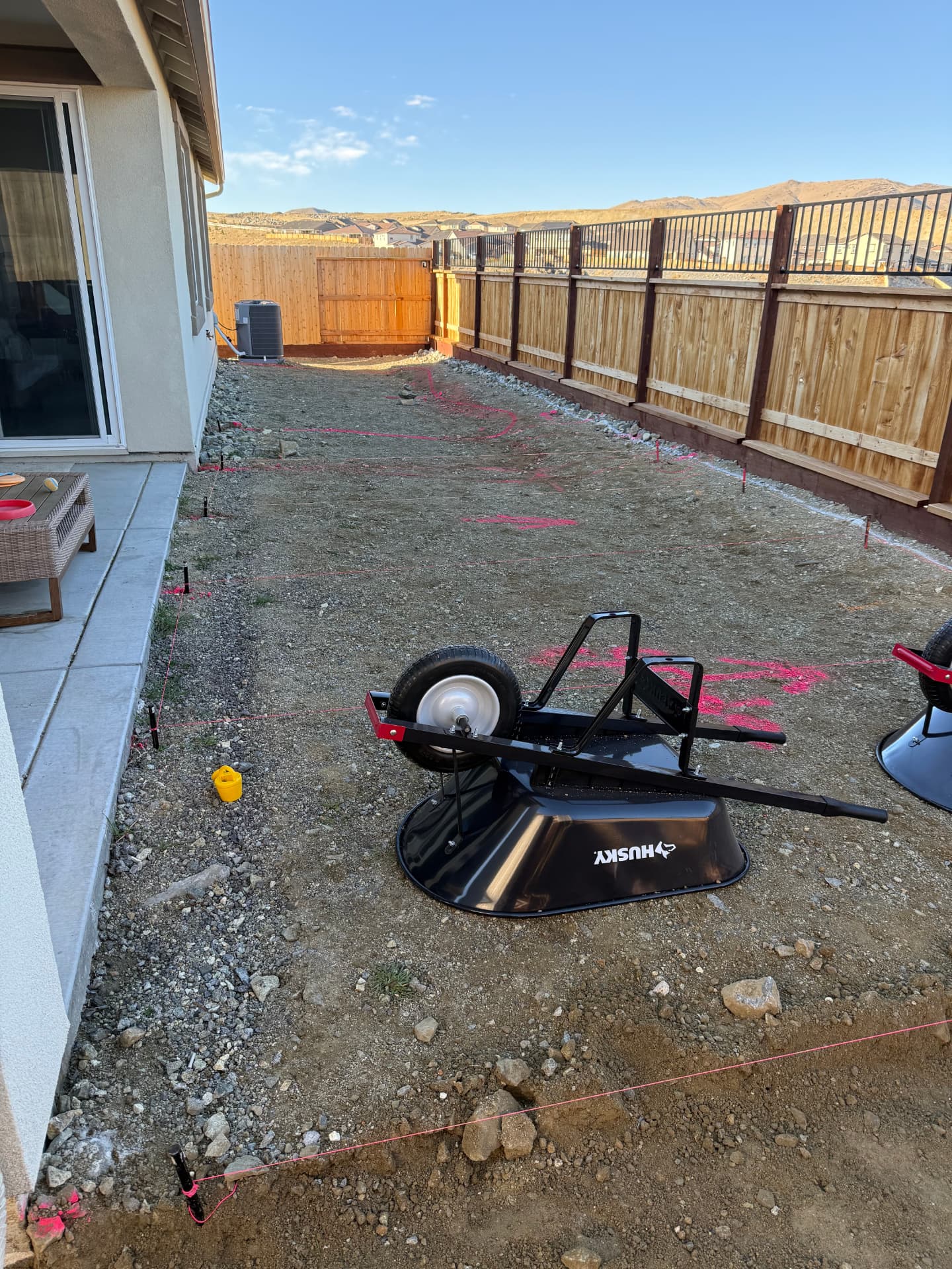 Backyard staked and strung for the new patio layout