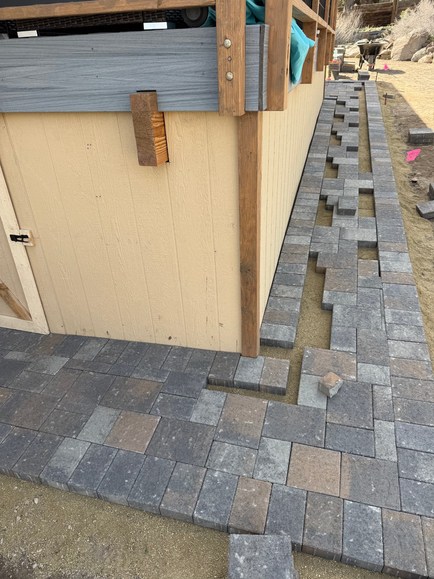 Herringbone paver field taking shape with contrasting border bands