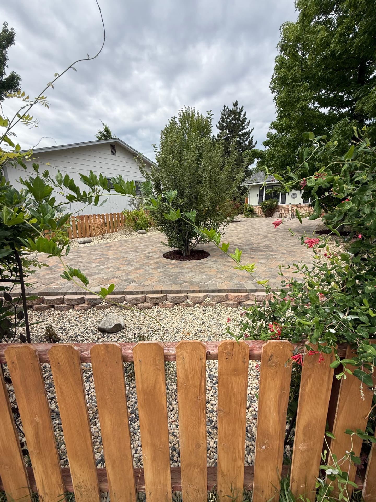 Completed front paver patio with tree ring and stone edging