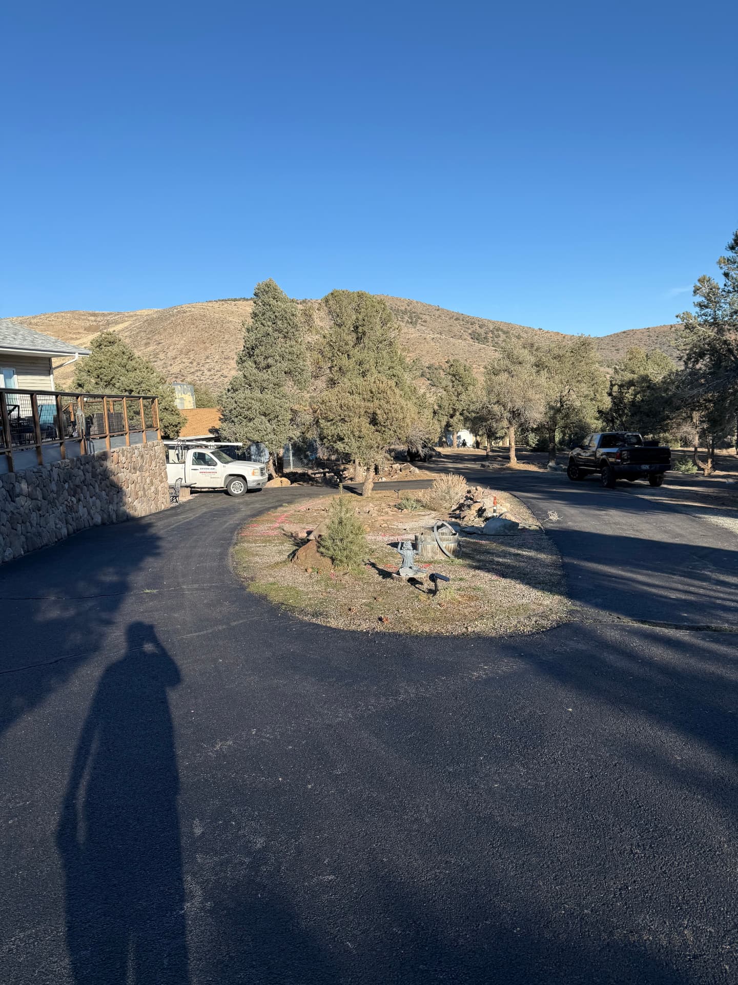 Wide view of the circular driveway and center island before work begins