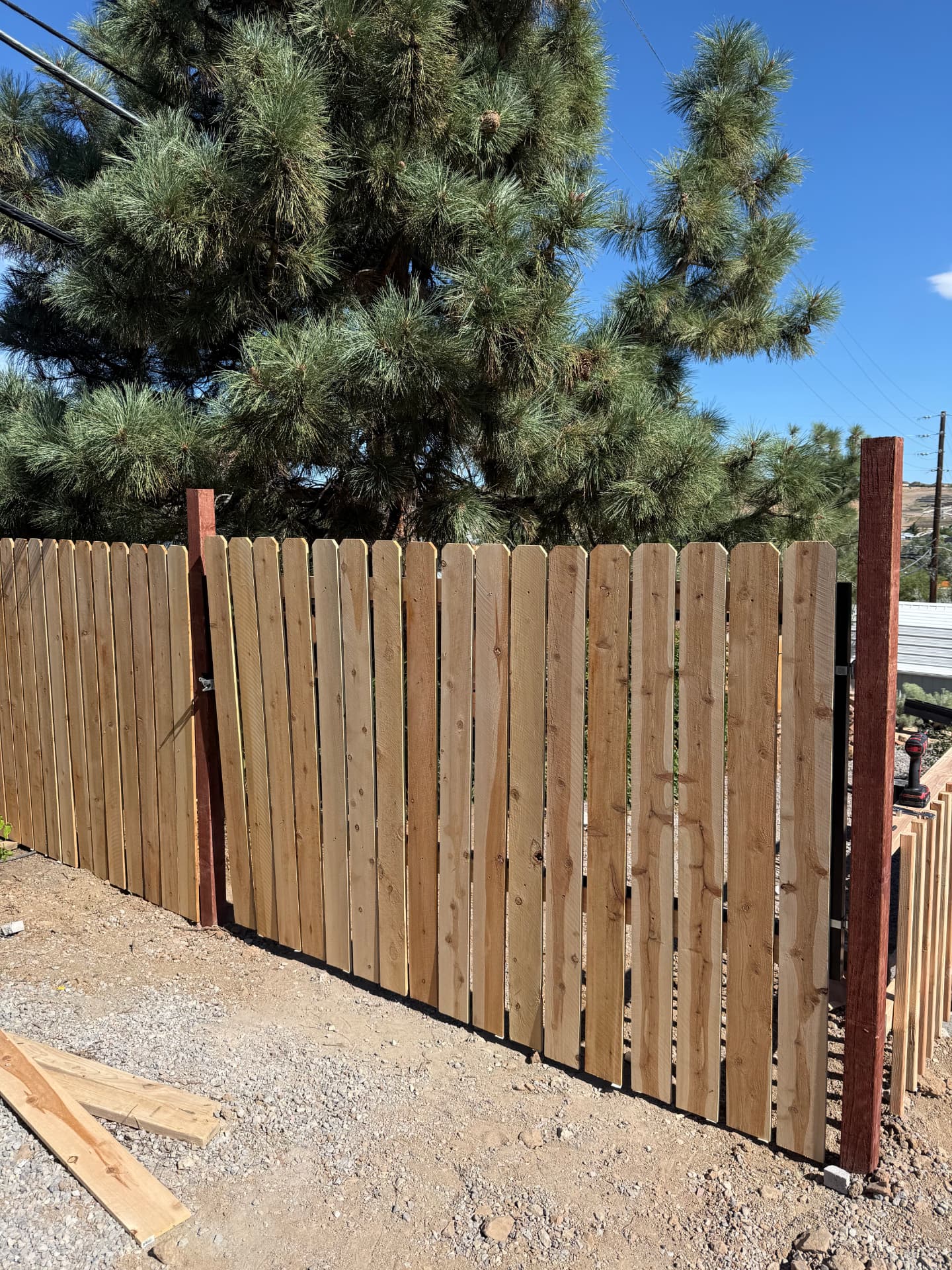Cedar privacy fence and gate going up on the property line
